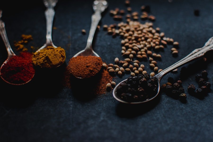 Herbs and spices in metal spoons — traditional herbal medicine ingredients